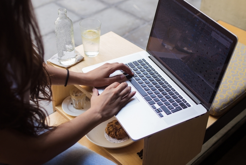 girl with laptop in coffee shop